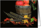 Thanksgiving apples in basket with pheasant feathers card
