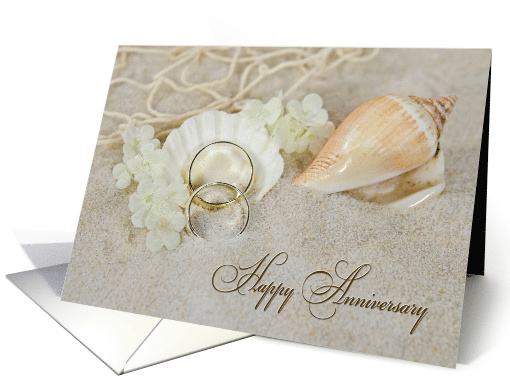 Wedding Anniversary, wedding rings and seashells in beach sand card