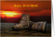 Retirement-old work boots om wood deck with sunset background card