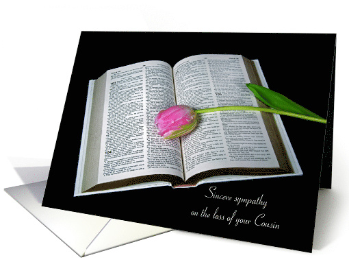 Loss of Cousin pink tulip on open Holy Bible on black card (1317550)