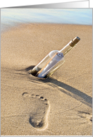 Miss You message in a bottle with footprint in beach sand card