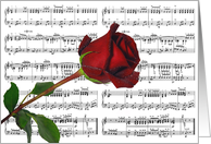 Wedding anniversary red rose on sheet music background card