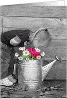 girl sniffing flowers in watering can card