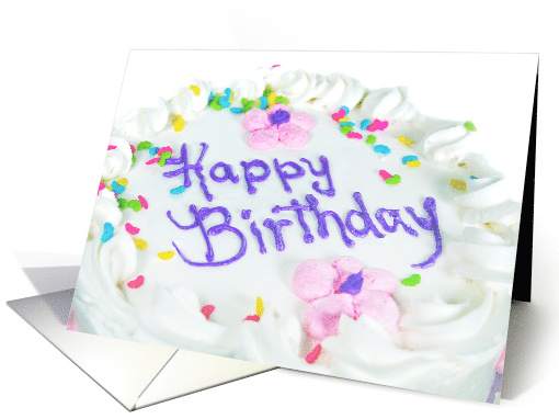 birthday cake with heart sprinkles on white icing and flowers card