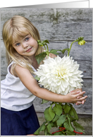 Birthday little girl hugging a giant white dahlia card