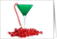 Holiday cocktail with candy cane and ribbon on white card