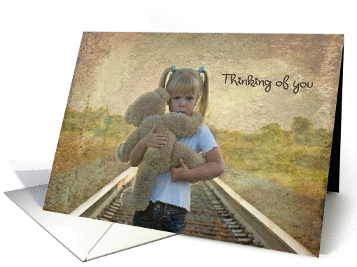 Thinking of you with sad child hugging a teddy bear on... (543048)