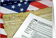U.S.Constitution and income tax form on flag card