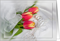 Anniversary tulip bouquet with silver rings on pillow card