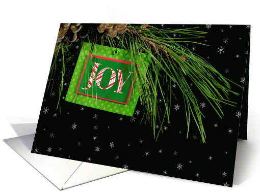 Christmas tag with joy text on pine bough with snowflakes card