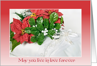 Christmas wedding poinsettia bouquet and rings on satin pillow card