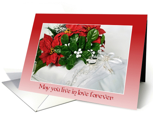 Christmas wedding-poinsettia bouquet and rings on Bible... (700217)