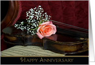 Anniversary-rose on a violin with old sheet music card