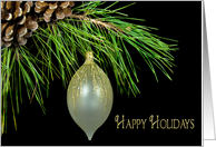 Christmas gold fancy ornament hanging from pine bough card