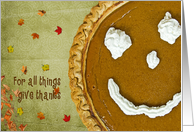 Thanksgiving pumpkin pie with autumn leaves card