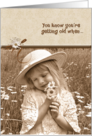 Birthday getting older humor with little girl with daisy bouquet card