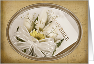 Wedding-daisy bouquet on a Holy Bible with gold frame card