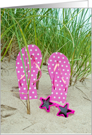 pink polka dot flip-flops with star sunglasses in sand card