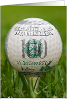 close up of a golf ball on a tee in grass for birthday card