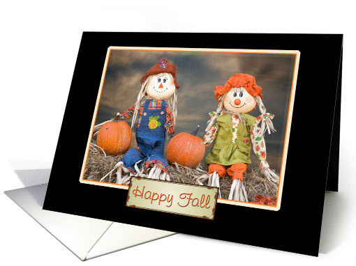 autumn scarecrows sitting on hay bale with pumpkins for... (864187)