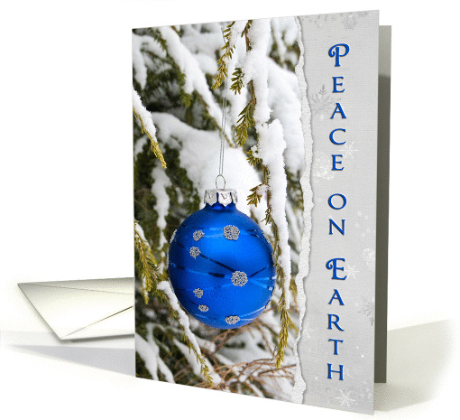 Christmas ornament on torn paper card (967983)