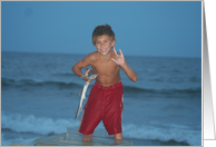 Sign Language at the beach, boy with fish card
