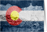 colorado flag on a brick wall card
