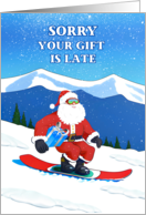Belated Christmas Funny Snowboarding Santa with a Wrapped Present card