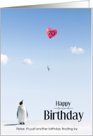 70th Birthday Penguin Looking up at Balloon Floating By card