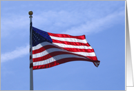 American Flag at full mast flying high against a blue sky card
