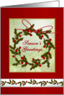 Christmas season’s greetings with wreath and holly card