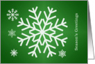 Season’s Greetings Christmas card - white snowflakes on green card