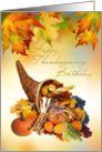 Birthday on Thanksgiving day card with Cornucopia and leaves. card