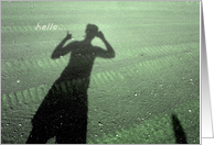 Hello - shadow silhouette of woman on sand photography card