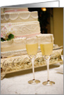 2 cups of Champagne next to cake card