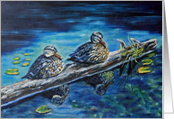 Two ducks sitting on a log in the pond card