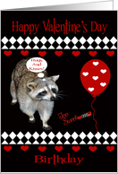 Birthday On Valentine’s Day a Raccoon with Red Hearts and a Balloon card