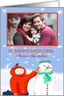 Season’s Greetings across the miles ,Child and snowman, photo frame. card