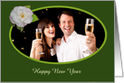Happy New Year, white Camellia on green background.photo frame. card