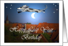 Happy leap Year birthday, shaggy dog jumping over moon. card