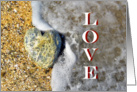 Love, heart shaped pebble on beach, blank note card