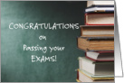 Congratulations, on passing your exams.pile of books.blank card, blackboard. card