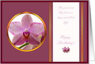 happy birthday, pink orchid in a rounded golden frame over a purple background card