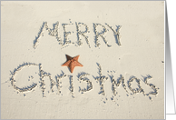 Merry Christmas greeting written in sand card