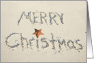 Merry Christmas greeting written in sand card