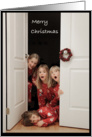 Merry Christmas children peaking at door card