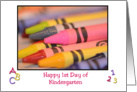 Happy 1st Day of Kindergarten, white background with colorful crayons framed in black card