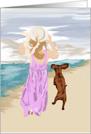 Girl and puppy friends at the ocean card
