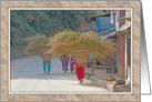 CARRYING GRASS FODDER THROUGH VILLAGE IN NEPAL card