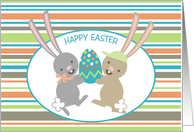 Cute dancing girl boy bunnies decorated egg Happy Easter card